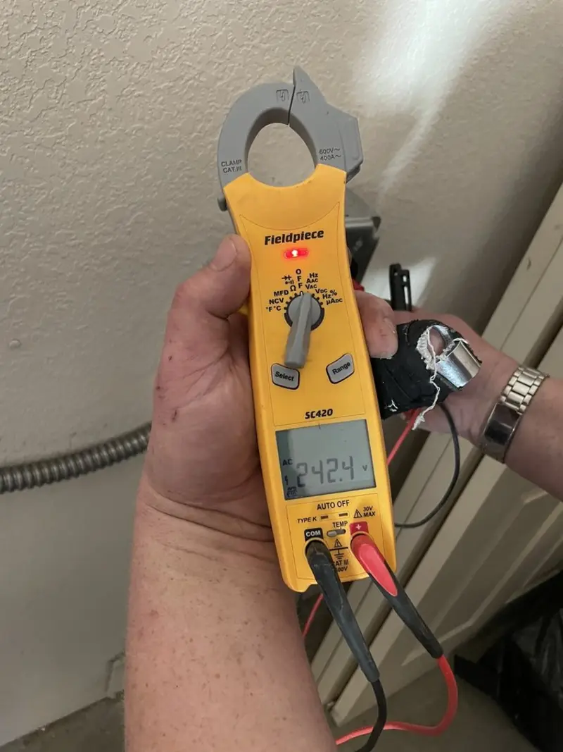 Voltage testing with clamp meter during Generator Installation in North Lynnwood